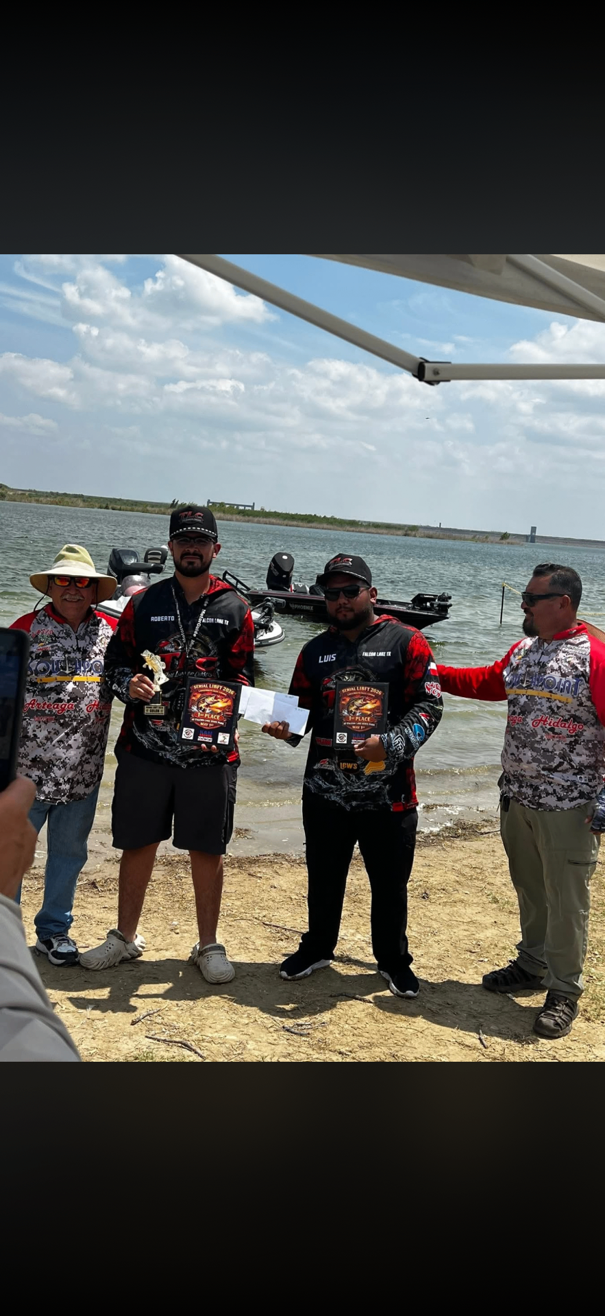 Roberto and Luis holding the 1st Place plaques at Falcon Lake
